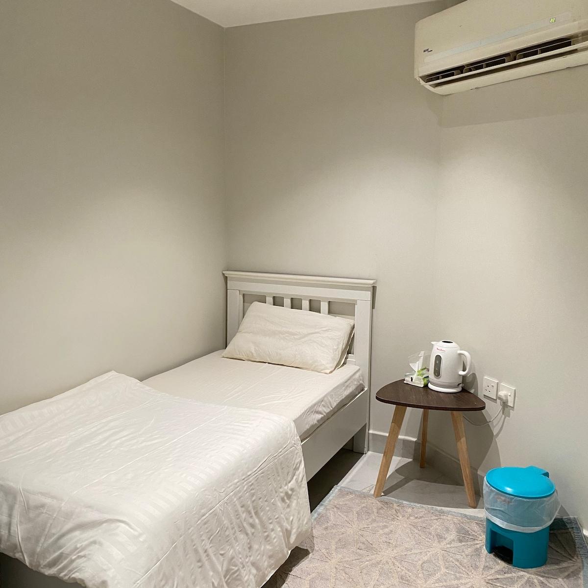 A small room with a separate entrance bathroom