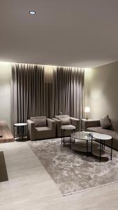 A suite with a room and a lounge with a quiet and modern design - image 4