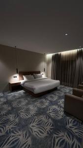 A suite with a room and a lounge with a quiet and modern design - image 12