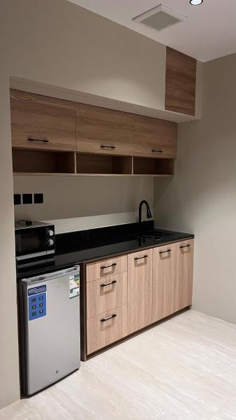 A suite with a room and a lounge with a quiet and modern design - image 2