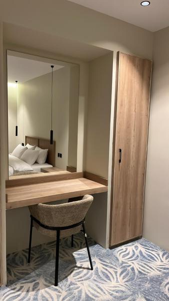 A suite with a room and a lounge with a quiet and modern design - image 14