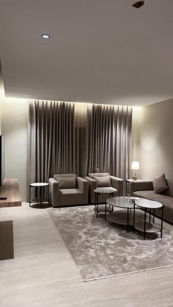 A suite with a room and a lounge with a quiet and modern design - image 1
