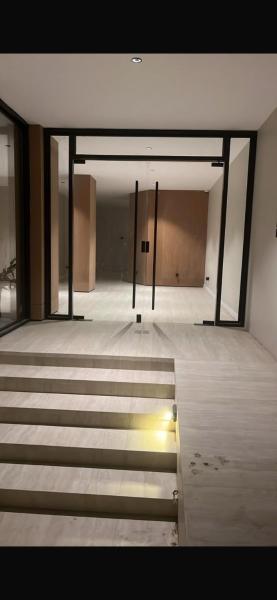 A suite with a room and a lounge with a quiet and modern design - image 17