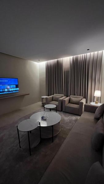 A suite with a room and a lounge with a quiet and modern design - image 16