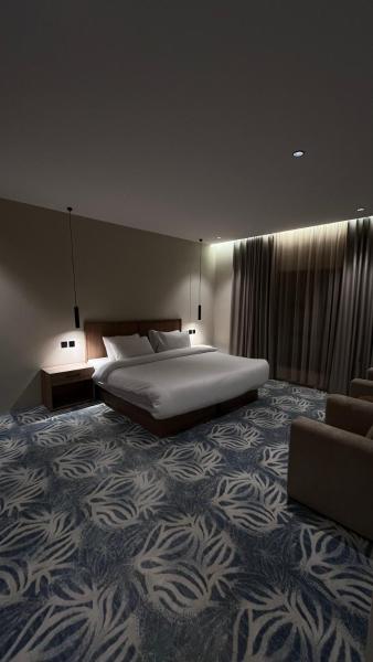 A suite with a room and a lounge with a quiet and modern design - image 12